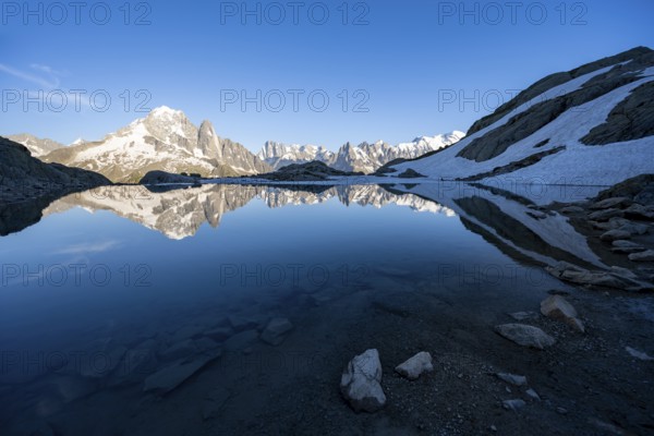 Mountain landscape in the evening light, water reflection in Lac Blanc, mountain peak, Aiguille