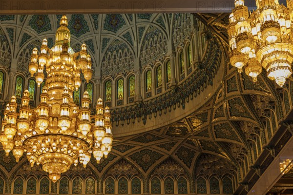 Dome and illuminated chandeliers in the Sultan Qaboos Mosque, Muscat, Arabian Peninsula, Sultanate