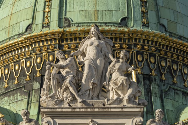 Statues on the dome of St Michael's Wing of the Hofburg Imperial Palace Palace in Vienna, Austria,