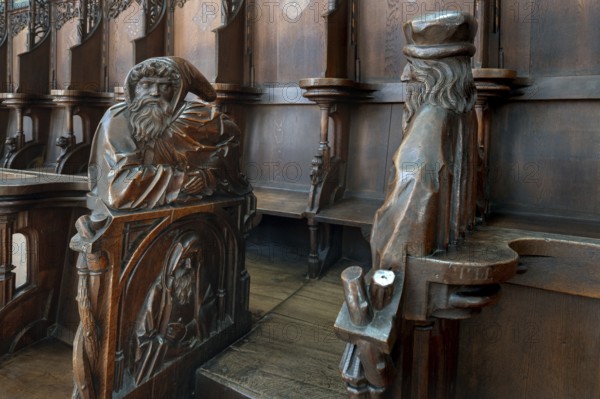 Figures on the late Gothic choir stalls from 1507, St Martin, Memmingen, Bavaria, Germany, Europe
