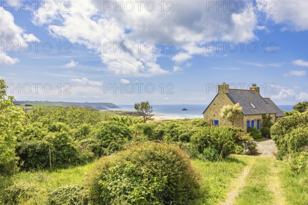 Old summer house on the french coast with a beautiful scenics seascape view and a lush green garden