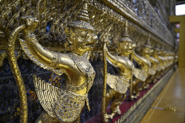 Golden sculptures of Garuda and Naga, Wat Phra Kaew, Temple of the Emerald Buddha, Bangkok,