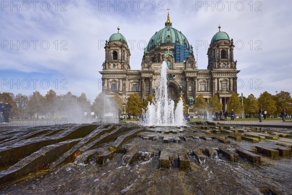Fountain in the Lustgarten from the frog's perspective and Berlin Cathedral, Berlin, capital city,