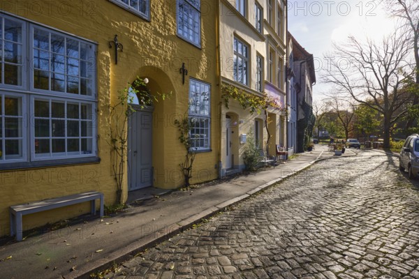 Street An der Obertrave, cobblestones, historic buildings with windows, doors and wall anchors,