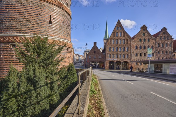 Holstentor city gate with historic salt stores, brick building, railings, Holstentorplatz street,