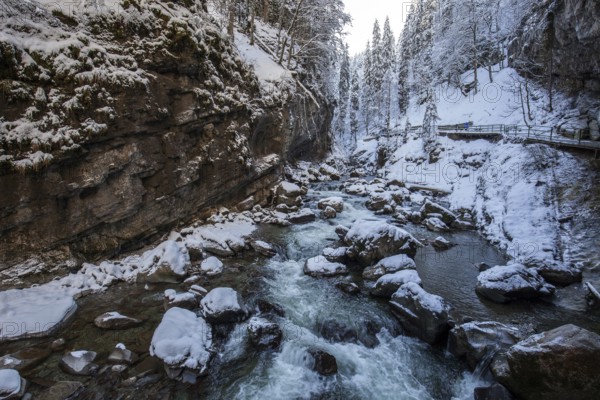Winter, snowy landscape, river Breitach and hiking trail through the Breitachklamm gorge near