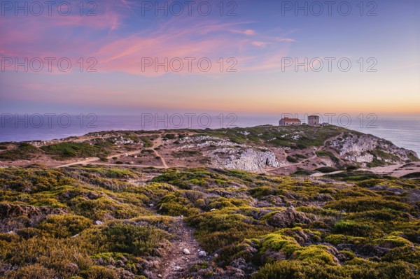 Cabo Espichel cape Espichel on Atlantic ocean at sunset with ruins