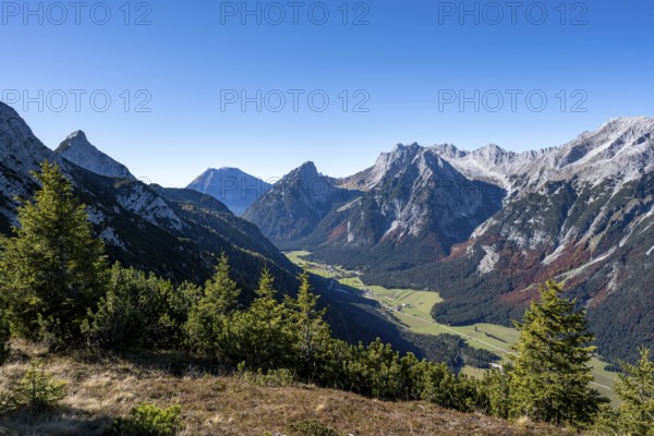 Mountain landscape in autumn, view of the Leutasch valley with mountain peak of the Wetterstein