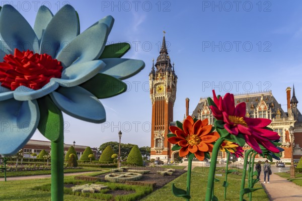 Giant artificial flowers in front of the town hall in Calais, France, Europe
