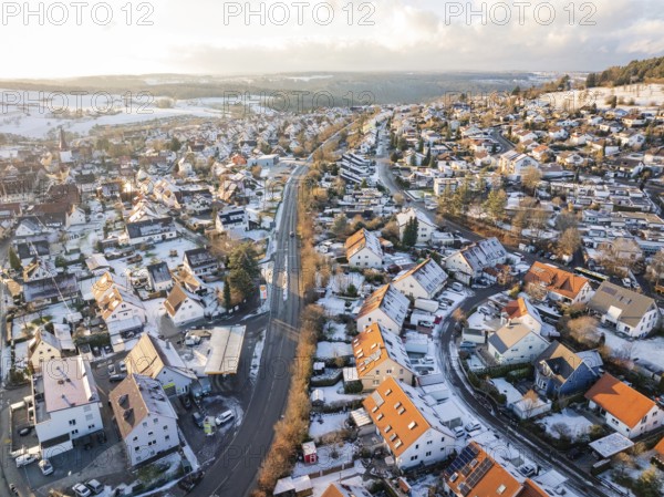 Snow-covered village with a main road dividing it into two halves, Calw- Stammheim, Black Forest,