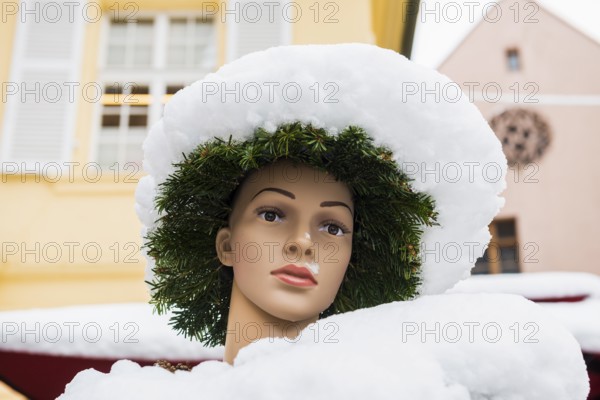 Mannequin covered with snow, Münsterplatz, Freiburg im Breisgau, Black Forest, Baden-Württemberg,