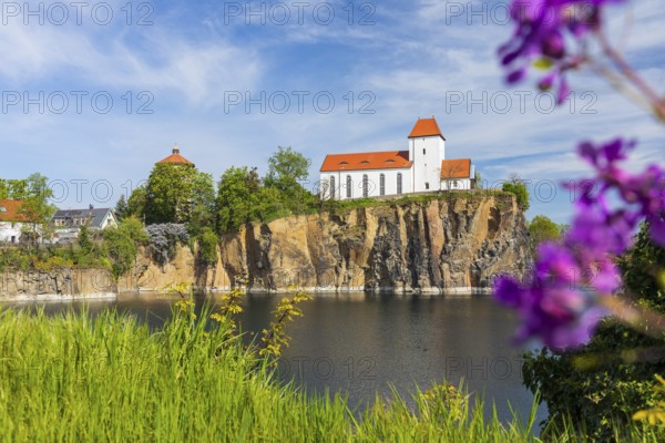 Mountain church and water tower on the Kirchberg, surrounded by the Kirchbruch quarry lake,