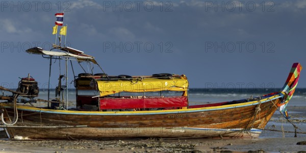 Longtail boat on the beach, at low tide, Koh Ngai Island, Andaman Sea, Satun Province, Southern