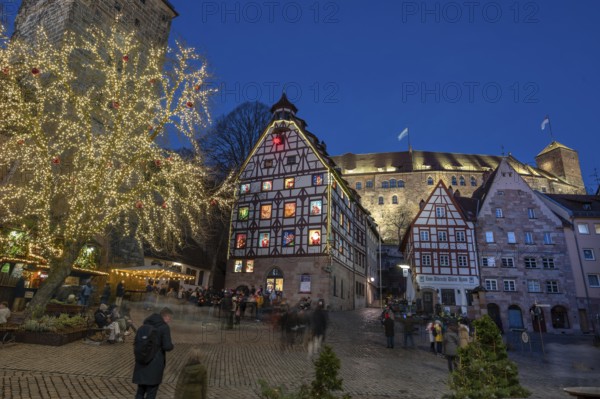 Historic Pilatus House with an Advent calendar designed by the Altstadtfreuden Nuremberg, behind