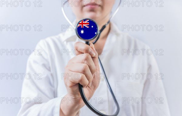 Australia National Healthcare concept. Female doctor showing stethoscope with Australia flag
