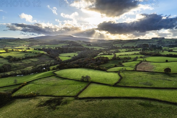 Farms over Trecastle from a drone at sunset, Brecon Beacons National Park, Powys, Wales, England,