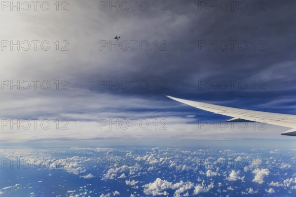 Above the clouds over the Indian Ocean, Bay of Bengal. View from the aircraft window during a