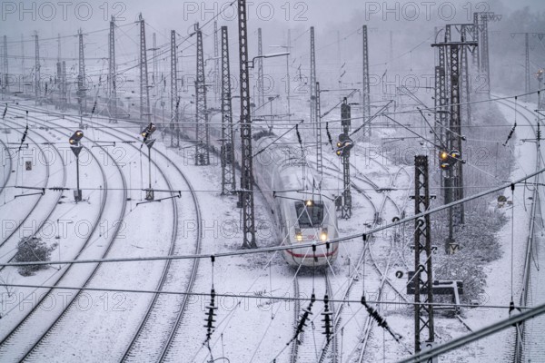 Winter weather, heavy snowfall, railway tracks in front of Essen main station, ICE train, North