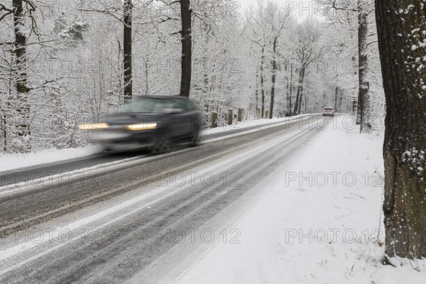 Winter road conditions with snow and icy conditions, here in Spitzgrund near Coswig, where there