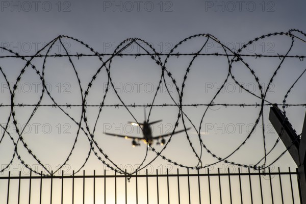 Symbolic image security at the airport, outer fence at Düsseldorf International Airport, steel wire