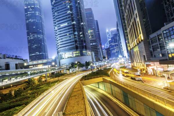 Hong Kong at night traffic with streets and skyscrapers in Hong Kong, China, Asia