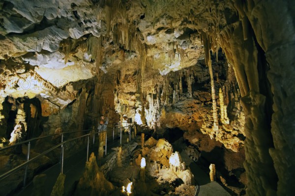 Cave with illuminated stalactites and stalagmites, stalactite cave, Diros Cave, Glyfada Cave,