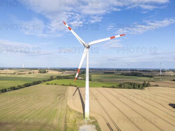 Wind turbine in a wind farm renewable energy wind power wind energy on the Baltic Sea aerial view