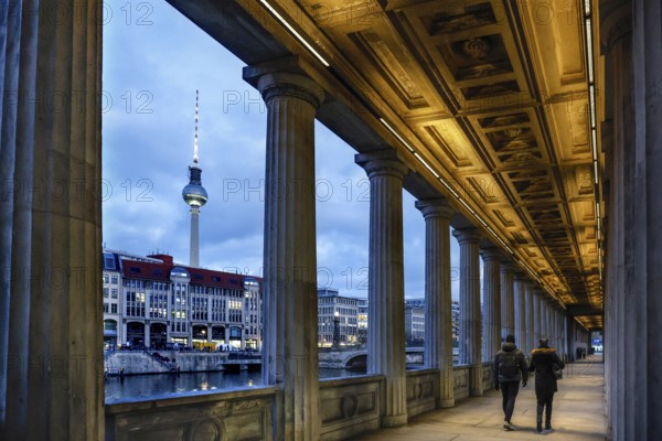 Illuminated arcade at the old National Gallery, view of the Spree and the television tower, Berlin,