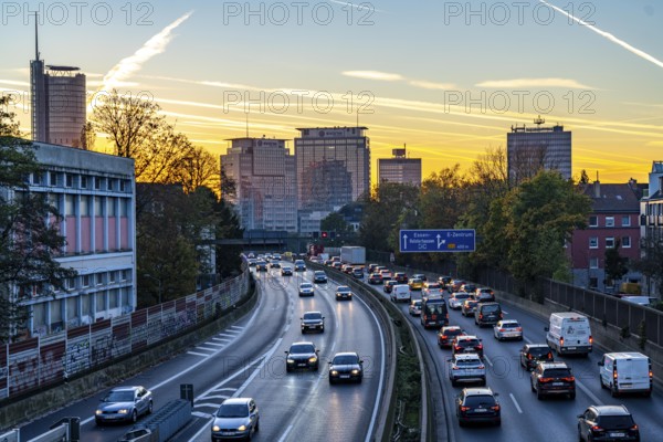 Evening traffic, partly with traffic jams, slow-moving traffic on the A40 motorway, skyline of