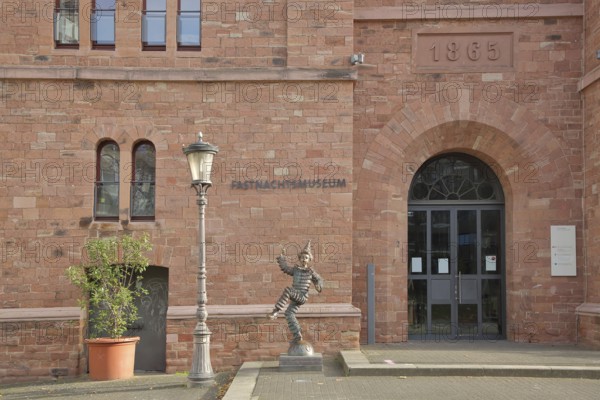 Entrance to the carnival museum, with sculpture of the Mainz Klepper-Garde, jester, dancing, merry,