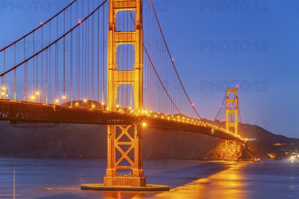The illuminated Golden Gate Bridge in San Francisco at dusk, California, United States of America,
