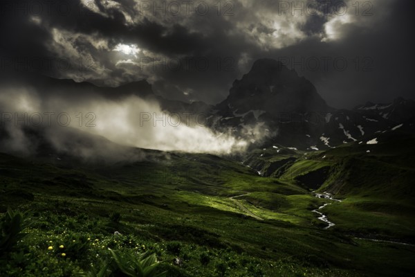 Peaks in the morning light and alpine landscape with dramatic clouds, Lech, Lechquellengebirge,