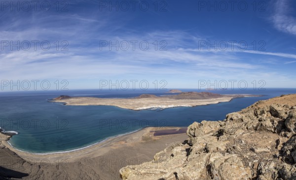 View of a sea coast and island La Graciosa with clear sky, Canary Islands, Lanzarote, Spain, Europe