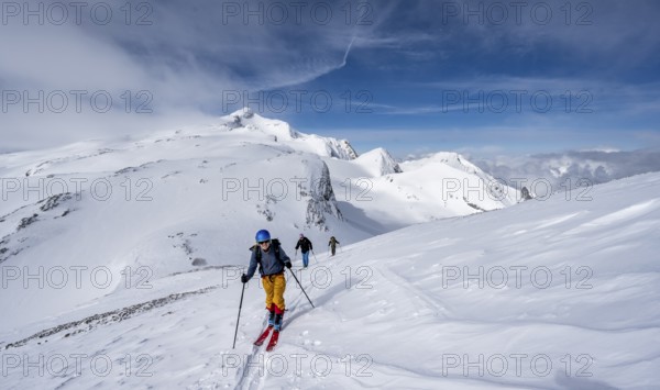 Group of ski tourers ascending the Schnidehorn, mountain landscape in winter, Wildhorn summit with