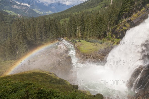 Krimml Waterfalls with rainbow. They have a total height of 380 metres (1, 247 feet) and are the
