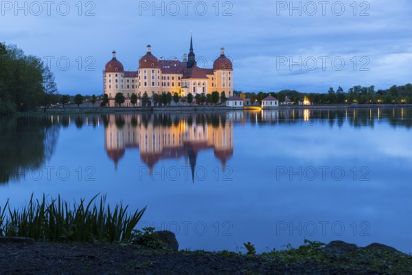 Moritzburg Hunting Lodge with reflection in the castle pond in the evening, Moritzburg, Saxony,
