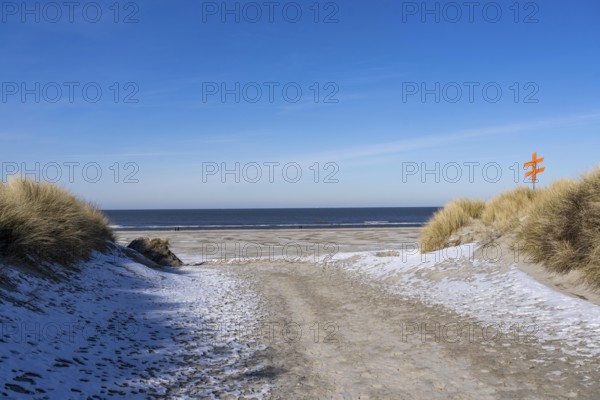 The East Frisian North Sea island of Juist in winter, dune crossing to the beach, snow, Lower
