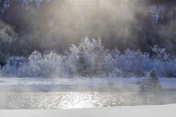 Isar valley in winter at temperatures of minus 18 degrees Celsius. Snow covered landscape with the