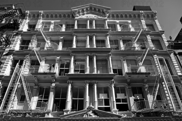 Neoclassical house facade with fire escapes, Downtown, New York City, USA, North America