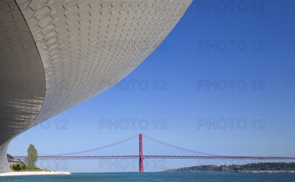 Lisbon, Landmark suspension 25 of April bridge over Tagus reiver near Belem tower