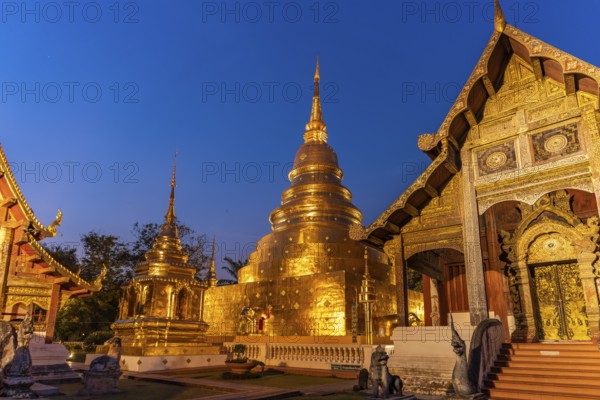 The Buddhist temple complex of Wat Phra Singh at dusk, Chiang Mai, Thailand, Asia
