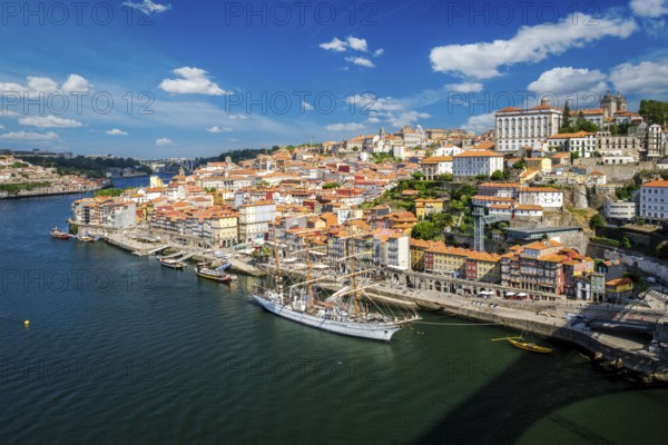 Aerial view of Porto city and Douro river with moored sailling ship from Dom Luis bridge I. Porto,