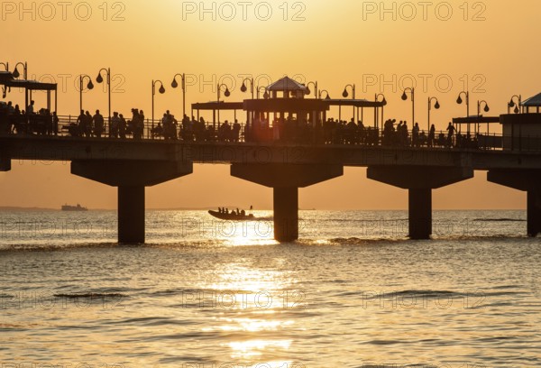 Sunset at the pier in Miedzyzdroje, Western Pomerania, Poland, East Europe, Europe
