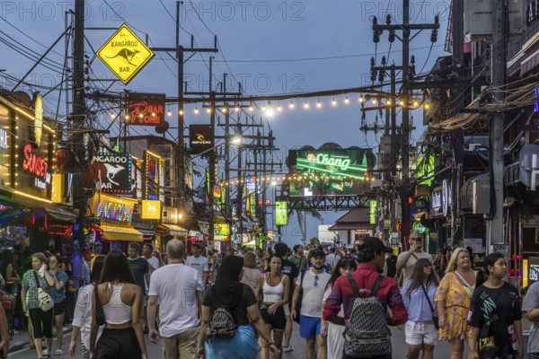 Crowds of people on Bangla Street in the evening. Nightlife on Bangla Walking Street with go-go