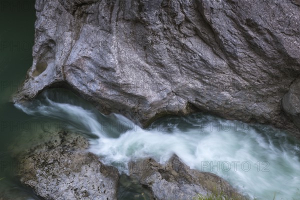 The Lammer creek is flowing fast through the Lammerklamm on a sunny hiking day
