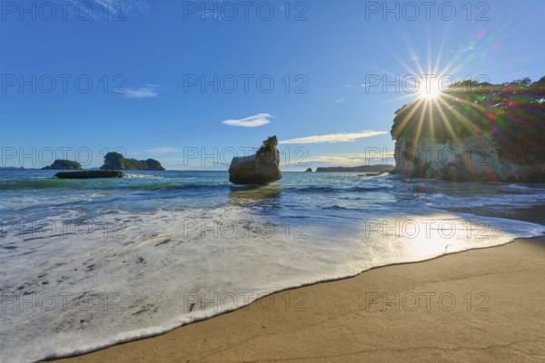 Rocky beach in clear weather with strong sunlight, Cathedral Cove, Coromandel, Canterbury, North