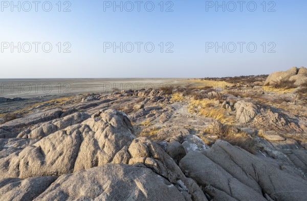 View over round rocks from Kubu Island (Lekubu) to the salt pan, at sunrise, Sowa Pan, Makgadikgadi