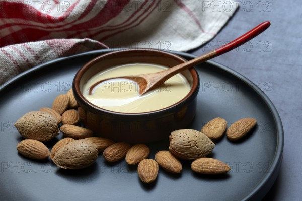 White almond cream in small bowls, almond butter