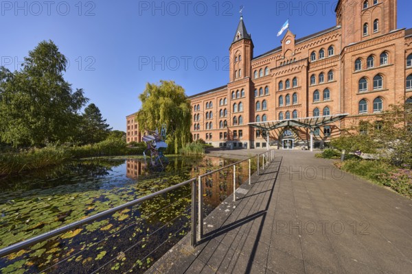 New town hall, brick architecture, architectural style neo-gothic, park, trees, footpath, pond,