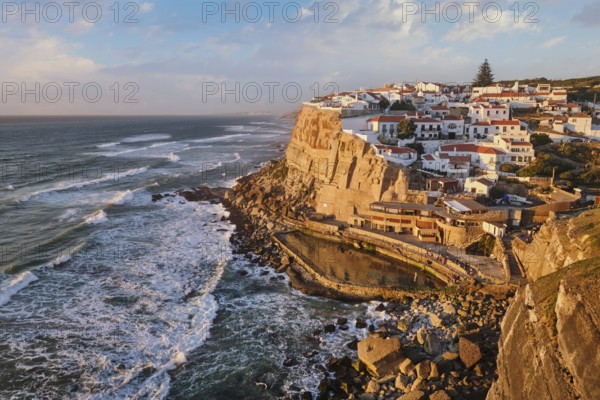 Scenic view of the seaside Azenhas do Mar fishing village on cliff on Atlantic ocean coast,